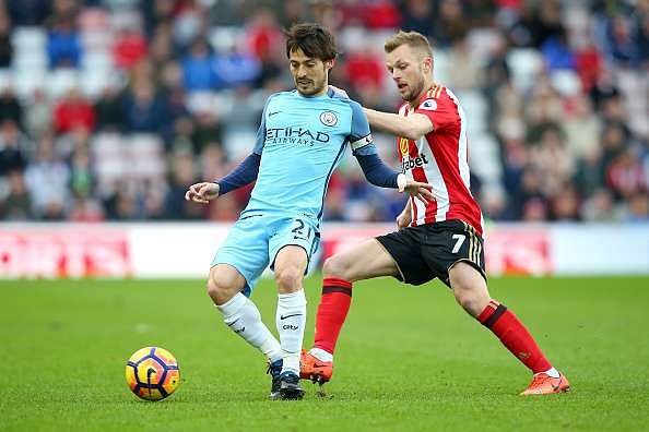 SUNDERLAND, ENGLAND - MARCH 05:  David Silva of Manchester City (L) is put under pressure from Sebastian Larsson of Sunderland (R) during the Premier League match between Sunderland and Manchester City at Stadium of Light on March 5, 2017 in Sunderland, England.  (Photo by Alex Livesey/Getty Images)