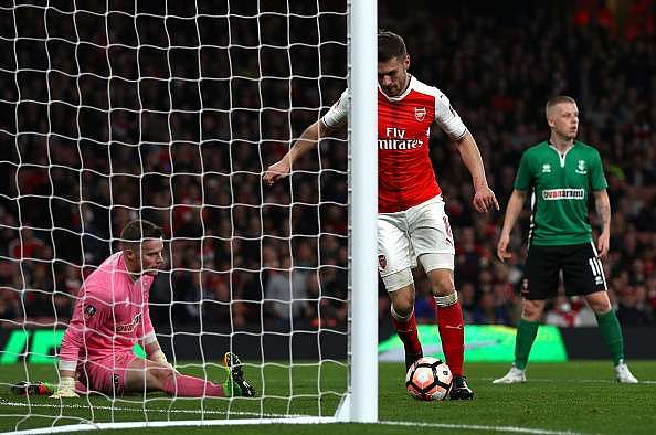 LONDON, ENGLAND - MARCH 11:  Aaron Ramsey of Arsenal scores his sides fifth goal during The Emirates FA Cup Quarter-Final match between Arsenal and Lincoln City at Emirates Stadium on March 11, 2017 in London, England.  (Photo by Ian Walton/Getty Images)