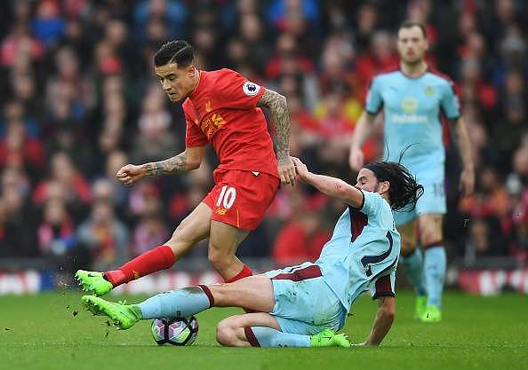 LIVERPOOL, ENGLAND - MARCH 12:  Philippe Coutinho of Liverpool is tackled by George Boyd of Burnley during the Premier League match between Liverpool and Burnley at Anfield on March 12, 2017 in Liverpool, England.  (Photo by Michael Regan/Getty Images)