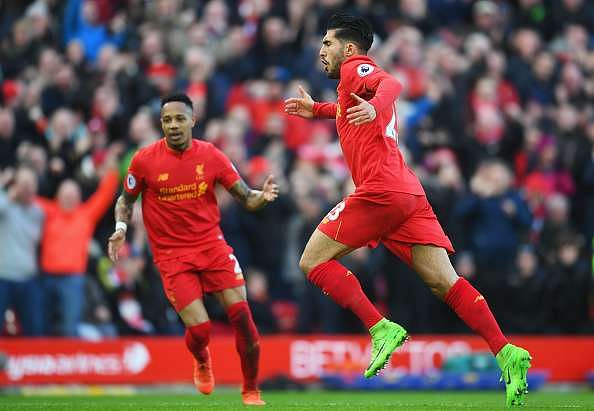 LIVERPOOL, ENGLAND - MARCH 12:  Emre Can (23) of Liverpool celebrates with Nathaniel Clyne as he as he scores their second goal during the Premier League match between Liverpool and Burnley at Anfield on March 12, 2017 in Liverpool, England.  (Photo by Michael Regan/Getty Images)