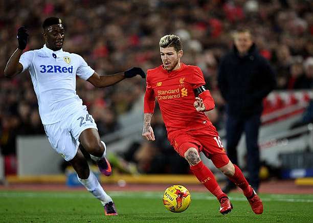 LIVERPOOL, ENGLAND - NOVEMBER 29:  Alberto Moreno of Liverpool takes on Hadi Sacko of Leeds United during the EFL Cup Quarter-Final match between Liverpool and Leeds United at Anfield on November 29, 2016 in Liverpool, England.  (Photo by Laurence Griffiths/Getty Images)