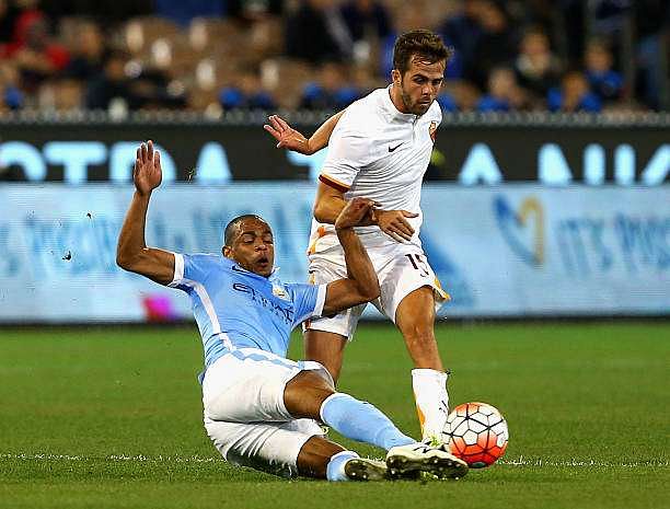 MELBOURNE, AUSTRALIA - JULY 21:  Fernando Reges of Manchester City and Miralem Pjanic of AS Roma contest the ball during the International Champions Cup friendly match between Manchester City and AS Roma at the Melbourne Cricket Ground on July 21, 2015 in Melbourne, Australia.  (Photo by Robert Prezioso/Getty Images)