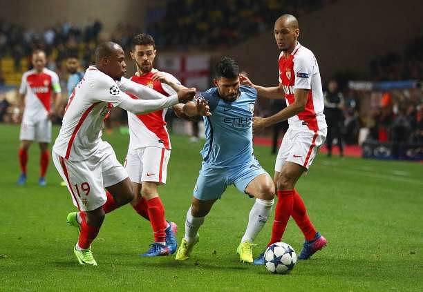 MONACO - MARCH 15:  Sergio Aguero of Manchester City takes on Djibril Sidibe, Bernardo Silva and Fabinho of AS Monaco during the UEFA Champions League Round of 16 second leg match between AS Monaco and Manchester City FC at Stade Louis II on March 15, 2017 in Monaco, Monaco.  (Photo by Michael Steele/Getty Images)