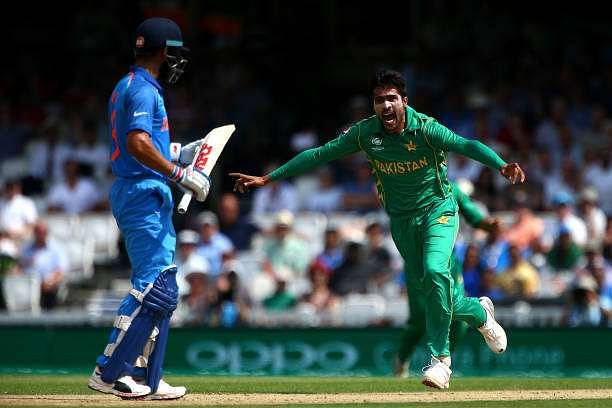 LONDON, ENGLAND - JUNE 18: Mohammad Amir of Pakistan celebrates after claiming the wicket of India&#039;s Virat Kohli during the ICC Champions Trophy Final match between India and Pakistan at The Kia Oval on June 18, 2017 in London, England. (Photo by Charlie Crowhurst/Getty Images)