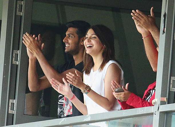 MELBOURNE, AUSTRALIA - DECEMBER 28:  Anushka Sharma, girlfriend of Virat Kohli smiles as Kohli celebrates after reaching his century during day three of the Third Test match between Australia and India at Melbourne Cricket Ground on December 28, 2014 in Melbourne, Australia.  (Photo by Scott Barbour/Getty Images)